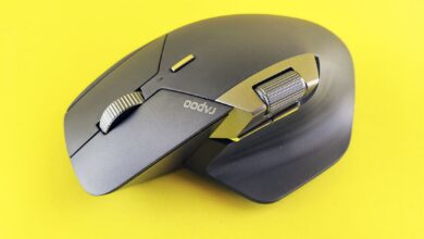 Close-up of a high-tech wireless mouse on a vibrant yellow backdrop, ideal for tech and lifestyle themes.