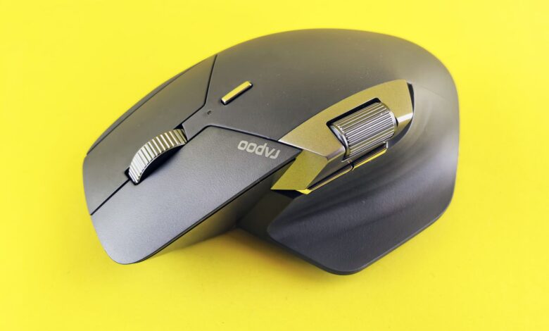 Close-up of a high-tech wireless mouse on a vibrant yellow backdrop, ideal for tech and lifestyle themes.