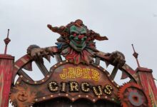 Creepy clown decoration at Jack's Circus entrance, perfect for horror themes.