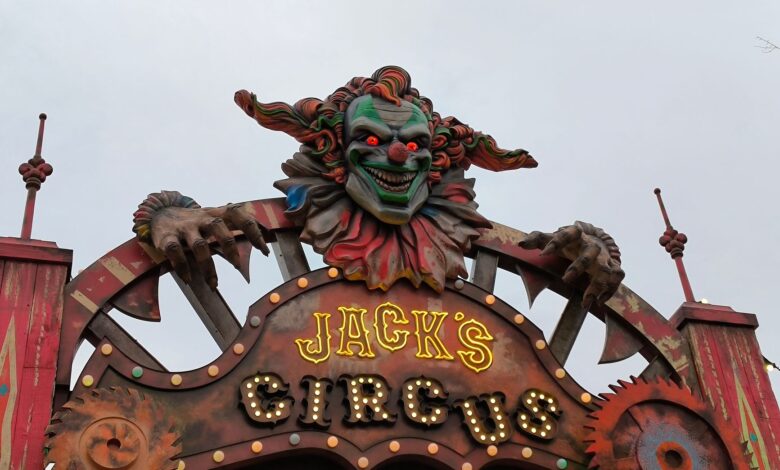 Creepy clown decoration at Jack's Circus entrance, perfect for horror themes.