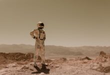 Astronaut standing in a desolate landscape, evoking sci-fi exploration on another planet.