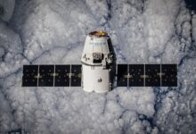 SpaceX Dragon spacecraft in orbit, highlighting advanced space technology with cloud backdrop.