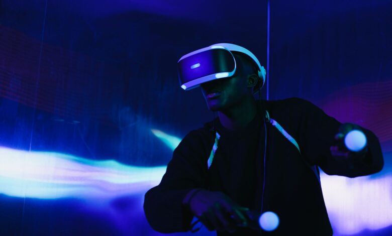A person engaged in a virtual reality game using a VR headset and motion controllers.