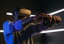 Man using VR headset and controllers in a futuristic room, engaged in gaming.