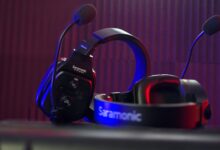Close-up of a Saramonic headset microphone with dynamic lighting in a studio.