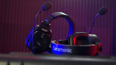 Close-up of a Saramonic headset microphone with dynamic lighting in a studio.