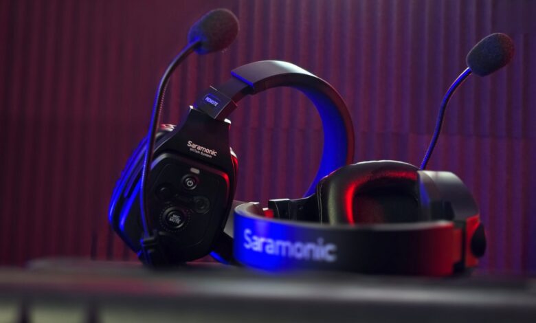 Close-up of a Saramonic headset microphone with dynamic lighting in a studio.