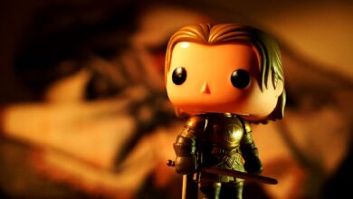 A cute toy figure in armor with dramatic light and warm tones, perfect for creative projects.