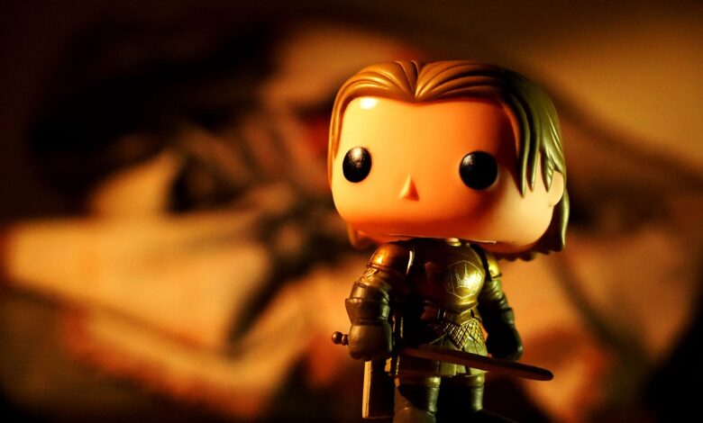 A cute toy figure in armor with dramatic light and warm tones, perfect for creative projects.