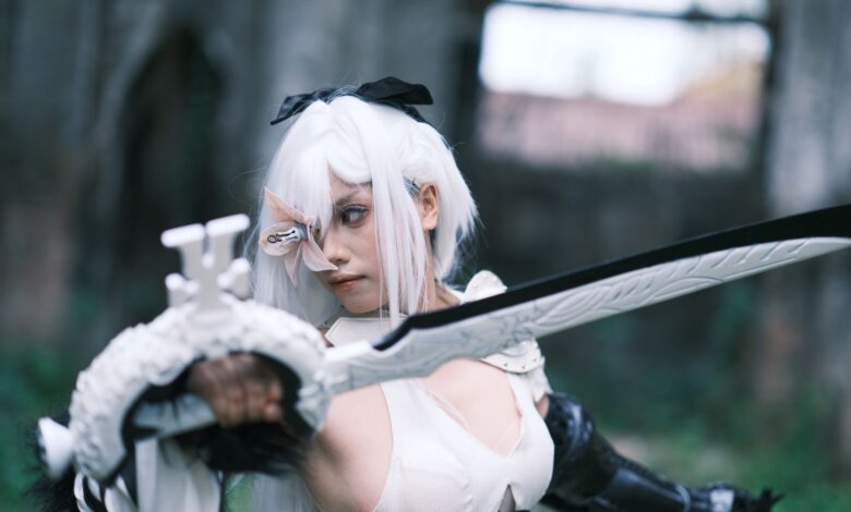 Captivating shot of a cosplayer in action with a sword amidst ancient Vietnamese ruins.