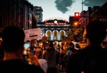 A protest at Denver's Union Station with signs supporting Minneapolis, captured at night.