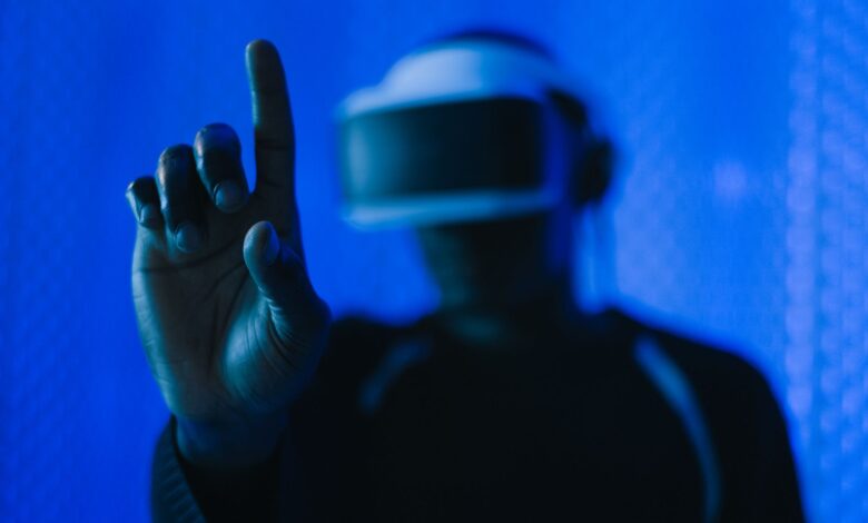 Close-up of a person in a VR headset interacting, showcasing a modern technology setup.