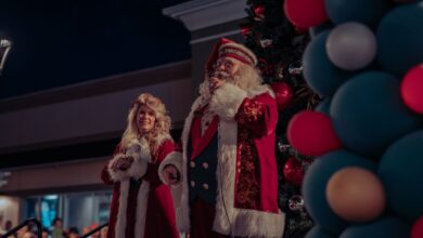 Santa and Mrs Claus spreading holiday cheer at a Christmas event.