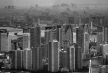 Monochrome cityscape of Tokyo featuring skyscrapers and urban landscape.