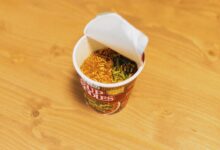 Delicious cup of instant noodles ready to prepare, showcasing Japanese fast food culture.