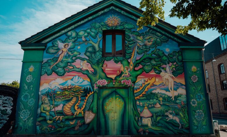 Colorful mural on a house facade in Christiania, Copenhagen, Denmark.