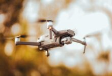 Close-up view of a high-resolution drone in flight with blurred background showcasing advanced technology.