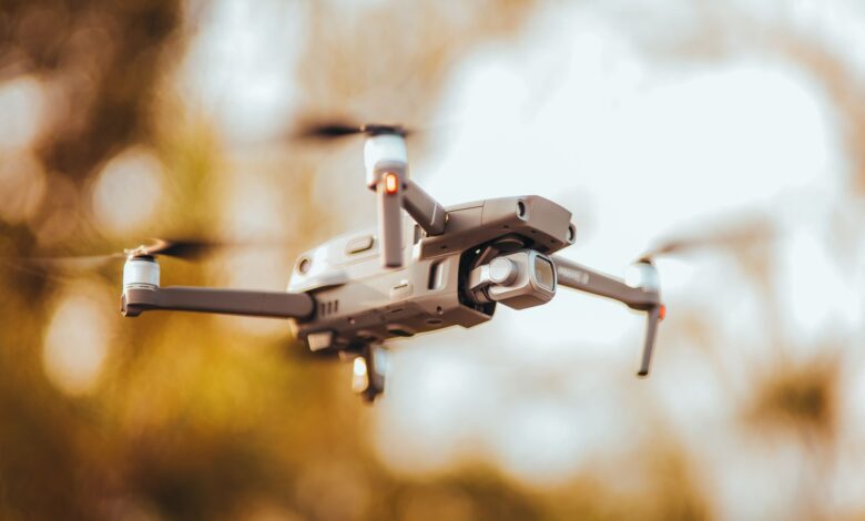 Close-up view of a high-resolution drone in flight with blurred background showcasing advanced technology.