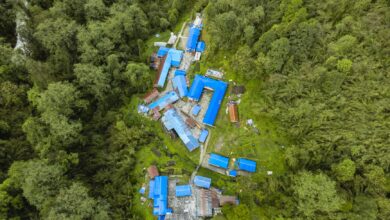 Explore Ghandruk, Nepal from above. This vibrant village is nestled in dense forests, showcasing stunning architecture.