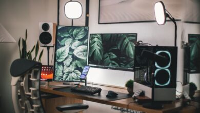 Stylish gaming and streaming setup with dual monitors, PC, and accessories.