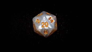 Close-up of a d20 die with glowing numbers against a dark background, symbolizing luck in role-playing games.