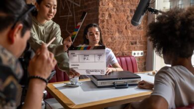 Engaging film crew capturing a scene indoors with diverse team and clapperboard.