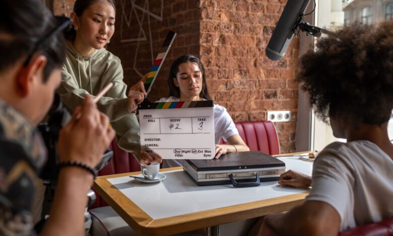 Engaging film crew capturing a scene indoors with diverse team and clapperboard.