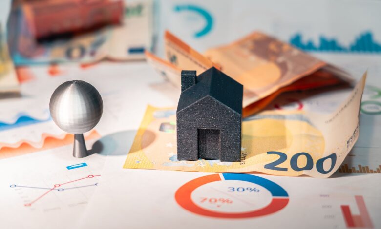 Conceptual image of real estate and finance involving euro currency and data charts, symbolizing investment.