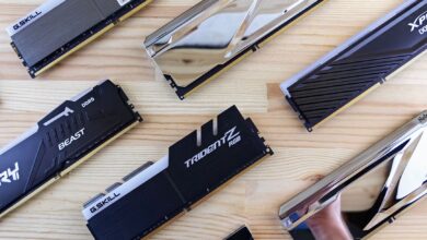 Top view of modern computer RAM sticks arranged on a wooden surface for technology enthusiasts.
