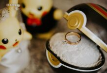Whimsical Pokemon-themed engagement scene with ring in Pokeball and cute figures.