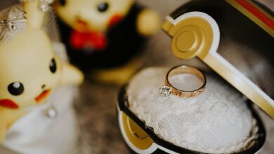 Whimsical Pokemon-themed engagement scene with ring in Pokeball and cute figures.
