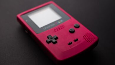 Red Nintendo Game Boy close-up showcasing retro gaming console design.