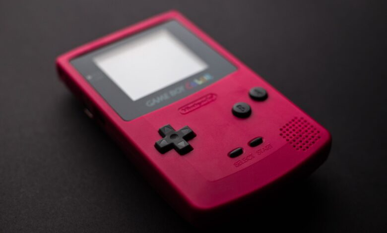 Red Nintendo Game Boy close-up showcasing retro gaming console design.
