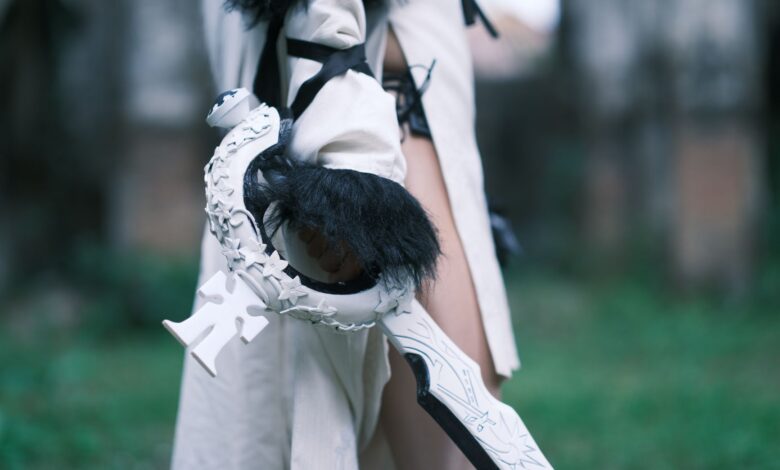 Detailed close-up of a cosplay costume emphasizing a uniquely designed sword, captured outdoors in Vietnam.