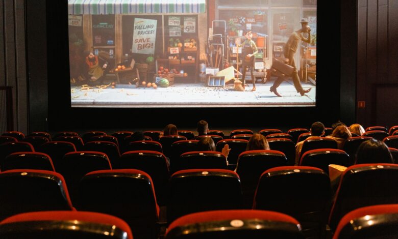 A cozy indoor movie theater showing an animated film to a small audience.