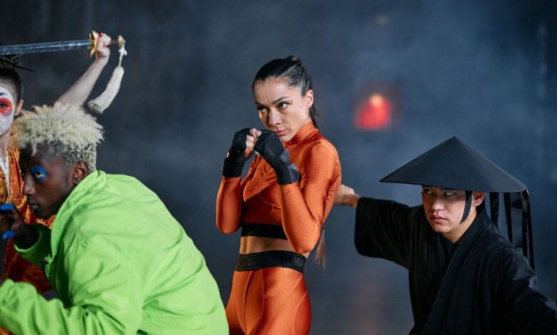 A dynamic group of cosplayers executing vivid poses indoors, evoking vibrant and dramatic themes.