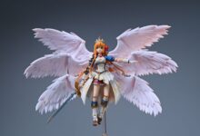 Detailed close-up of an anime figurine featuring a female warrior with wings.