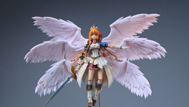 Detailed close-up of an anime figurine featuring a female warrior with wings.