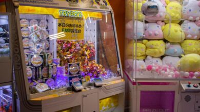 Vibrant arcade scene with candy and plush toy claw machines in Shibuya, Tokyo.