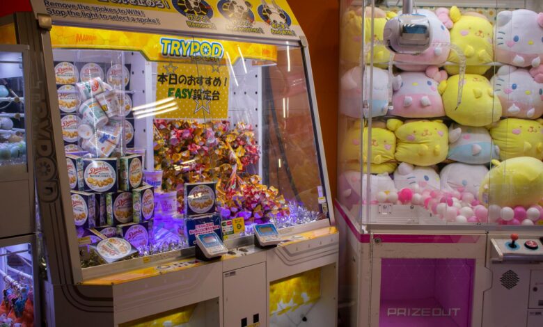 Vibrant arcade scene with candy and plush toy claw machines in Shibuya, Tokyo.