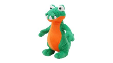 Colorful plush crocodile toy with vivid green and orange tones, perfect for children.