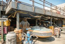 Explore a sci-fi junkyard filled with futuristic vehicles and equipment, perfect for industrial themes.