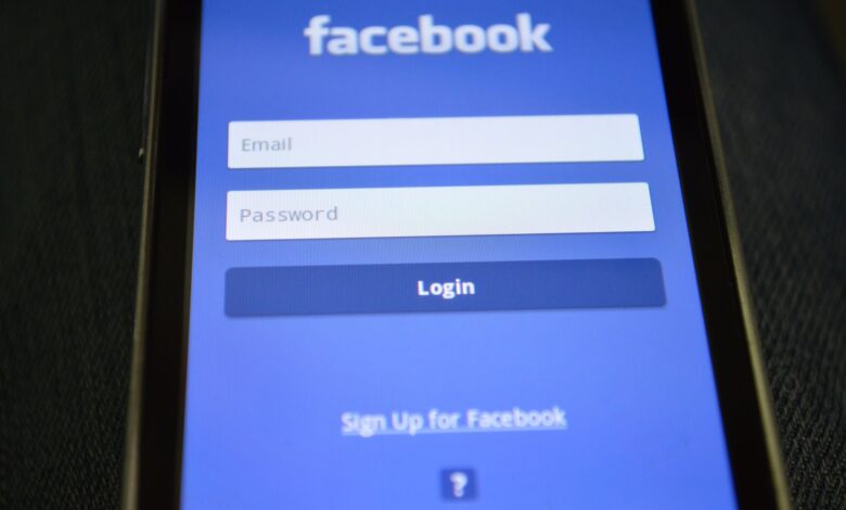 Close-up of a smartphone screen showing the Facebook login interface.