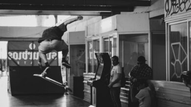 High-flying skateboard trick captured indoors in striking black and white.