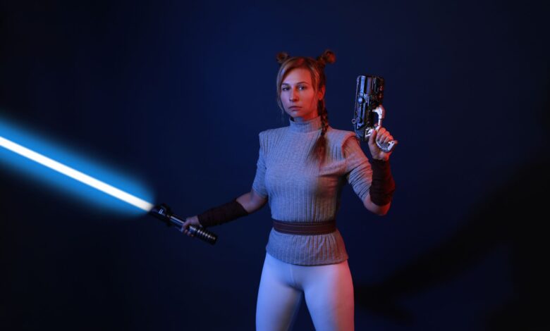 A woman dressed in sci-fi costume wields a lightsaber and blaster in a dramatic studio setting.
