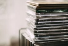 A stack of transparent CD cases neatly aligned, creating a still life composition.