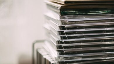 A stack of transparent CD cases neatly aligned, creating a still life composition.