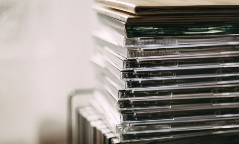 A stack of transparent CD cases neatly aligned, creating a still life composition.