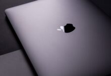 Close-up of a sleek, modern laptop featuring a minimalist design on a dark surface.