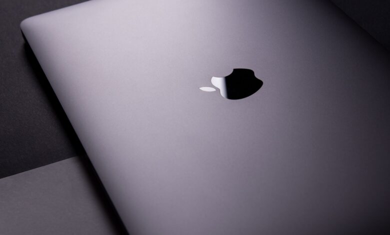 Close-up of a sleek, modern laptop featuring a minimalist design on a dark surface.